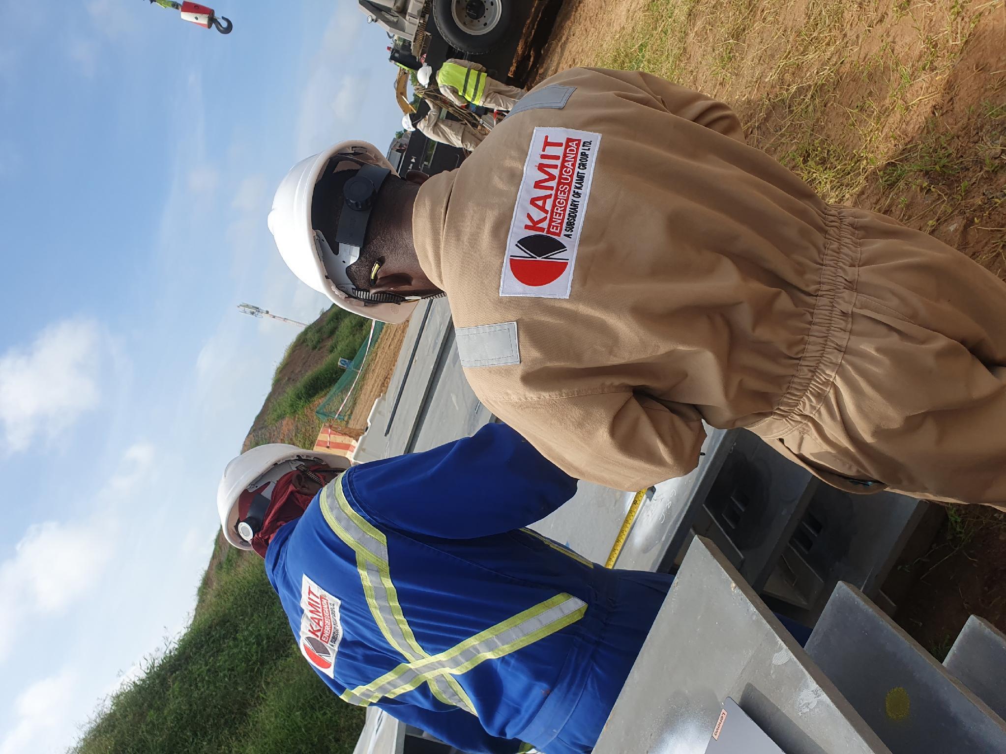 Field engineers conducting dimensional and alignment survey on construction site